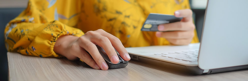 woman paying digital invoice with credit card
